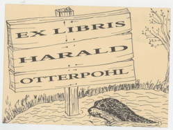 Schild mit Schriftzug "Ex Libris" auf Tafel in eierschale